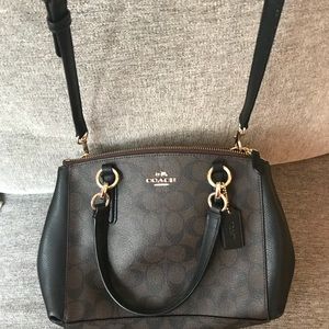 Brown and black Coach cross-body purse
